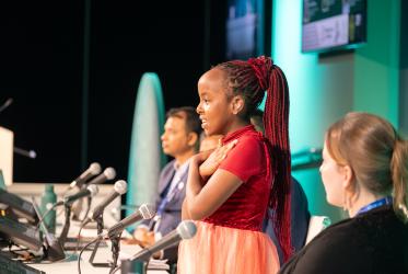 Girl speaks from the panel of COP28 conference